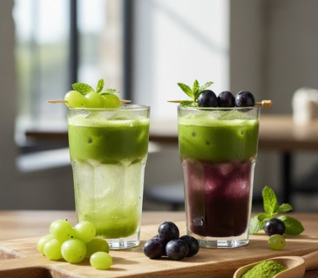 Glass of Grape & Matcha Cooler with ice and mint garnish