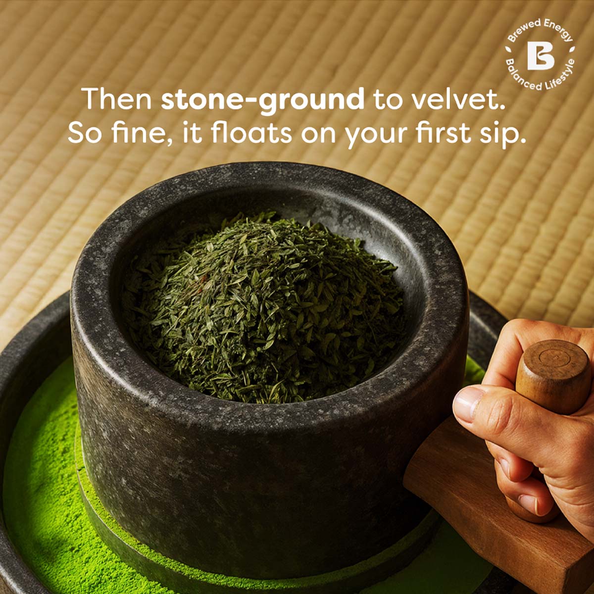 stone grounding matcha leaves to prepare matcha powder